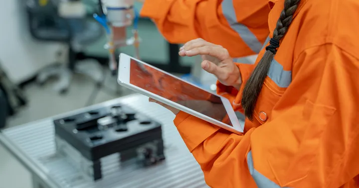 Operator with a tablet in the workshop